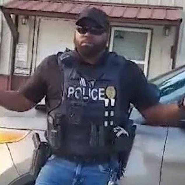 Officer Woodson (pictured) has since been placed on paid leave due to backlash from residents of the small town.  They are calling for the officer to be fired for his actions