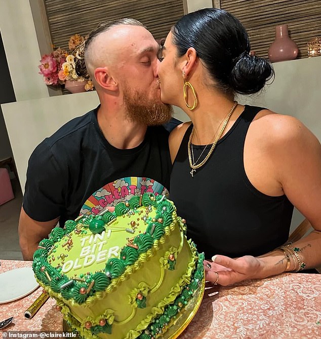 George and Claire shared a kiss as she showed off her cheeky Martini-themed birthday cake