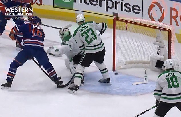 Connor McDavid's shot from the right was deflected off the stick and away from the net