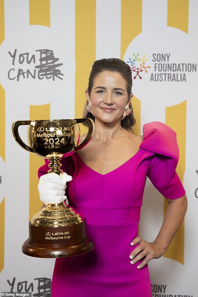 Melbourne Cup-winning jockey Michelle Payne made sure all eyes were on her as she arrived in a bright pink dress with puffed sleeves