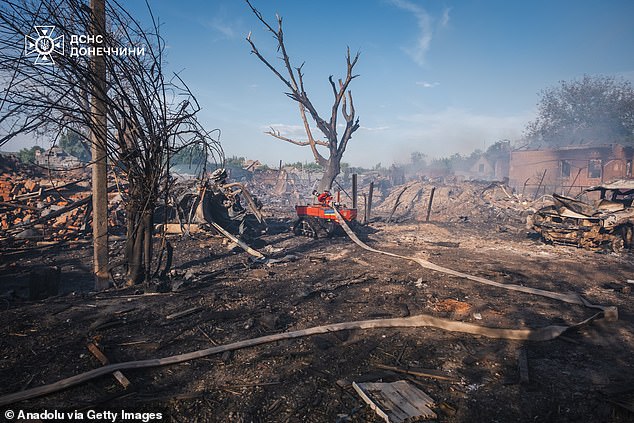 Ukrainian firefighters with the tactical robot Magirus Wolf C1 carry out firefighting efforts at the site of the Russian airstrike on the private residential area of ​​the city of Oleksievo-Druzhkivka