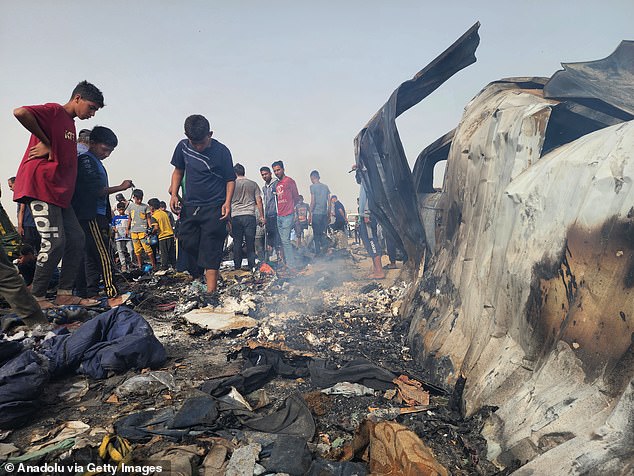 Palestinians witness the devastation after Israel bombed their tents and shelters in Rafah, Gaza