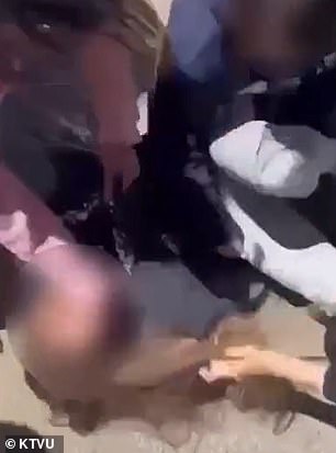 The student in gray pants is seen being beaten by others