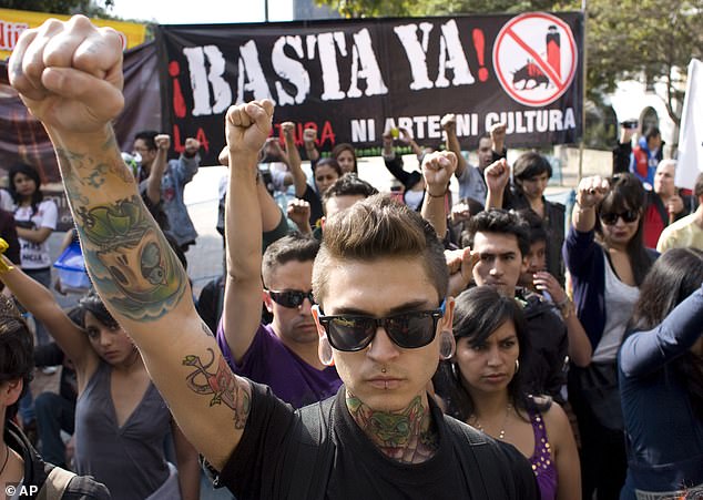 People protest against bullfighting outside the Santa Maria bullring in Bogotá, the capital of Colombia, on January 22, 2012. On Tuesday, Congress voted to ban bullfighting in the South American country.