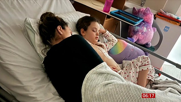 Andriani (pictured) with her daughter Siena in intensive care as she underwent a five-hour operation for her heart defect