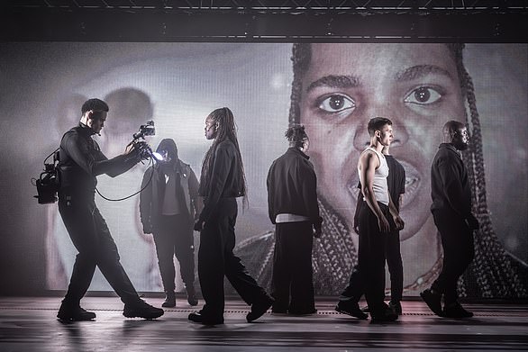 Instead we get the Stygian darkness of Soutra Gilmour's set design – empty except for lighting rigs and a giant cinematic billboard showing close-ups of the action as cameramen follow actors on stage and around the building itself (Romeo's banishment to Mantua takes him to the roof)