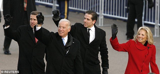 Joe Biden walks down Pennsylvania Avenue with his sons Beau and Hunter and his wife Jill during the inaugural parade