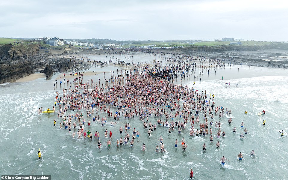 CORNWALL, UK: Scores of swimmers decided to brave the icy waters of Cornwall's Bude Beach on Christmas Day