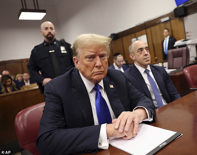 Donald Trump (pictured in court today) faces 34 felony counts of falsifying corporate documents, charges that carry a maximum penalty of four years in prison.  He has denied any wrongdoing and pleaded not guilty