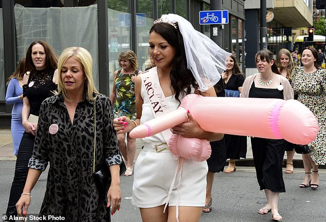 The bride at a bachelor party is depicted with an inflatable penis in her hands.