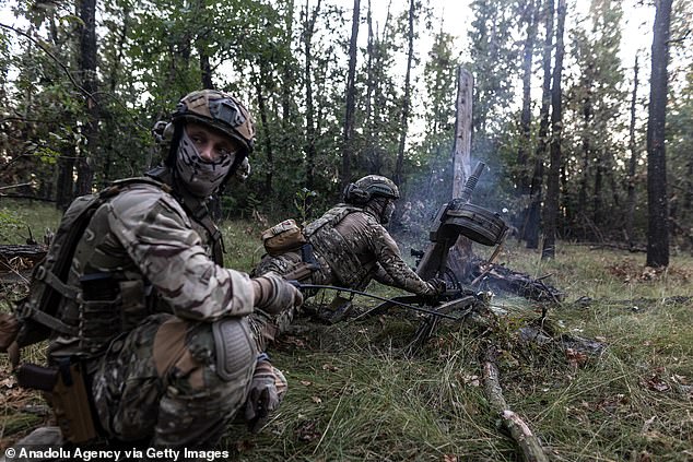 Ukrainian soldiers fire a grenade launcher as the war between Russia and Ukraine continues towards Avdivka