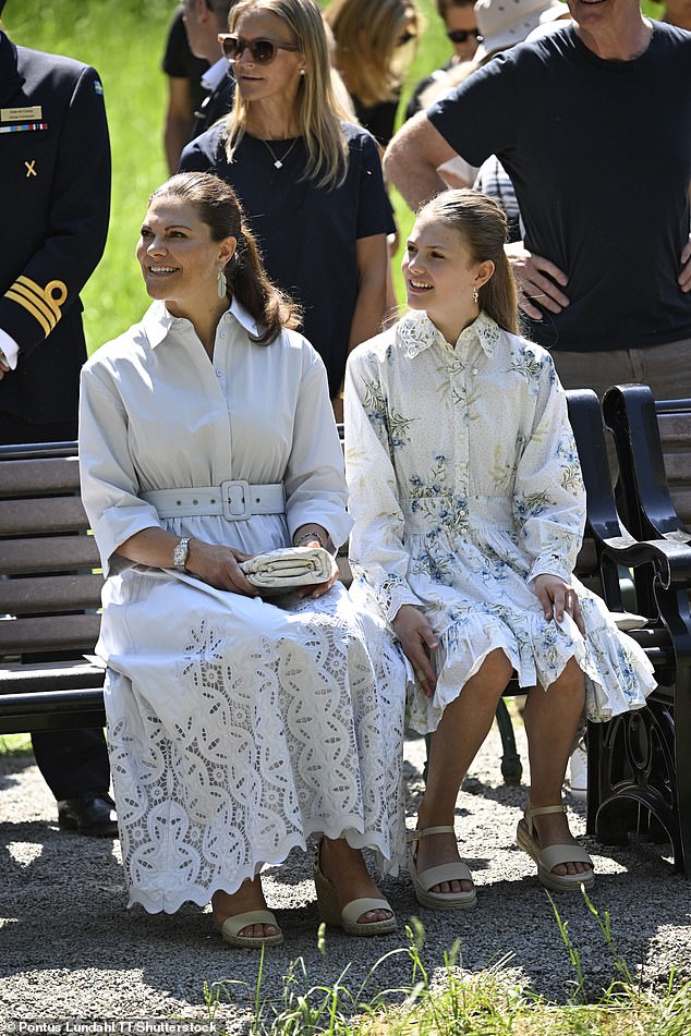 The mother and daughter were pictured side by side looking ethereal in elegant button-up dresses and loosely tied ponytails.