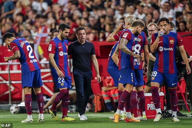 Recently sacked Barcelona coach Xavi (centre) explained that his replacement would 'suffer' due to financial constraints at the club