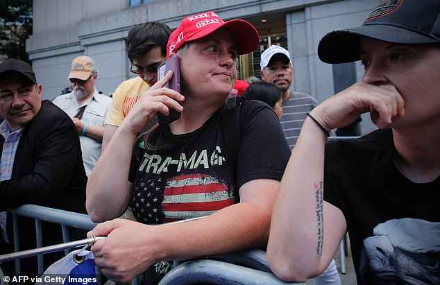 Trump supporters react after the verdict was announced in the criminal trial of former US president and Republican presidential candidate Donald Trump