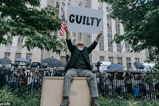 An anti-Trump protester reacts outside the courthouse after former US President Donald Trump was found guilty during his criminal trial