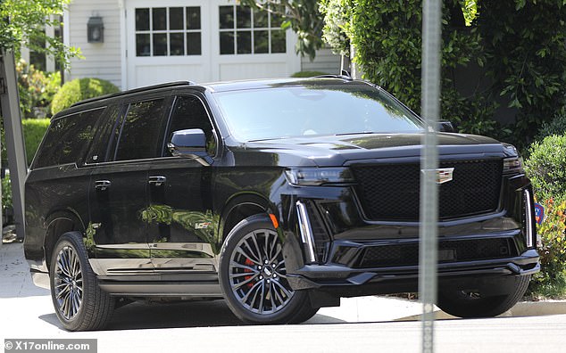 She was immediately seen getting into her Cadillac Escalade and driving away (pictured), but Ben appeared to stay behind in his $100,000-a-month rented mansion