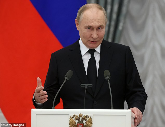 Russian President Vladimir Putin (photo) speaks during an awards ceremony in the Kremlin