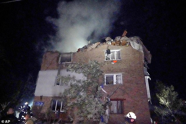 Firefighters extinguished the blaze in an apartment building damaged by the Russian missile attack in Kharkiv, Ukraine