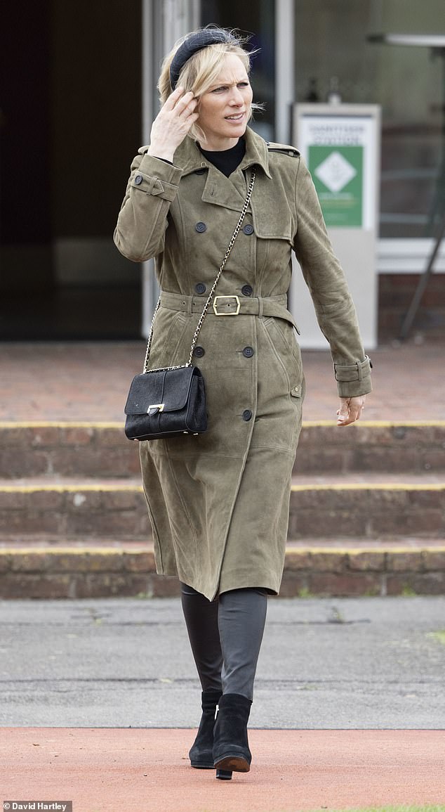 Zara Tindall paired tight leather pants with a suede trench coat for a visit to the races in April