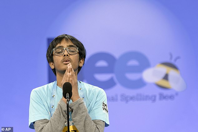 Runner-up Faizan Zaki prays before his turn in the spell, where he swallowed a whopping 20 words in 90 seconds but failed to win