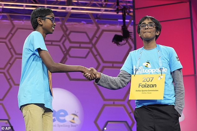 Both contestants shook hands as Soma (left) emerged victorious over Zaki (right) with a record 29 words in 90 seconds