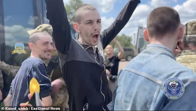 The captured soldiers whooped and cheered as they returned home