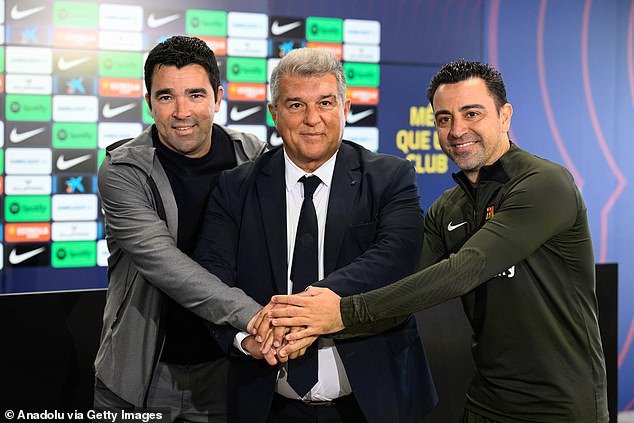 He worked at Deco (left) and Laporta after deciding to stay on as manager last month