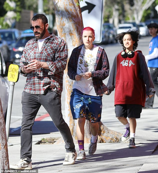 The two were photographed with Affleck on a Los Angeles street in February, with Fin wearing a striking temporary pink hair dye.