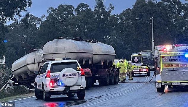 Three members of the same family were killed in a horror crash between a car and a tanker near Brisbane on Thursday morning (photo, police on scene)