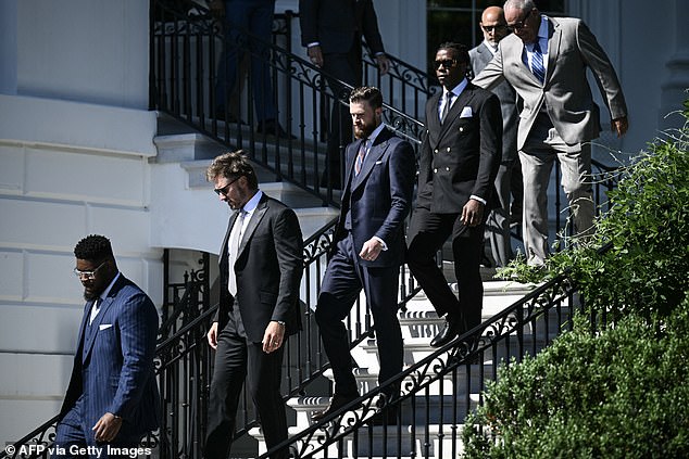 Members of the Kansas City leadership, including kicker Harrison Butker (third from left) arrive at a ceremony on South Lawn Friday