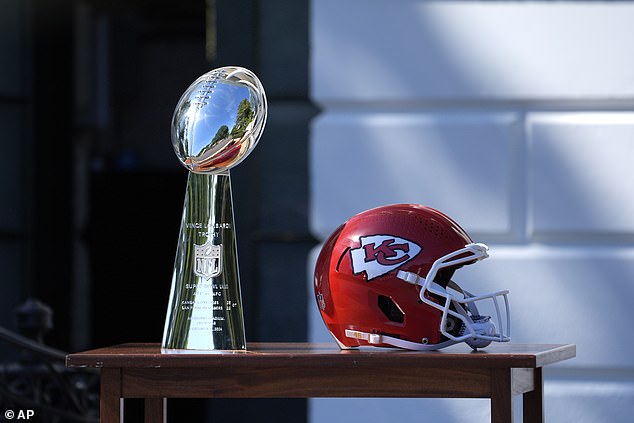 Prior to the team's arrival, the Lombardi Trophy (left) and Kansas City Chiefs helmet (right) that would be presented to Biden sat on a table on the South Lawn.
