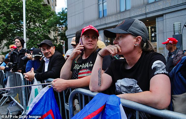 Trump supporters react after a verdict was handed down in the criminal trial of former US president and Republican presidential candidate Donald Trump