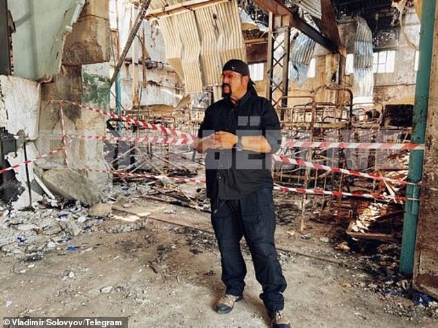 American actor Steven Seagal is seen inside the bombed complex where at least 50 Ukrainian prisoners were killed on July 29.