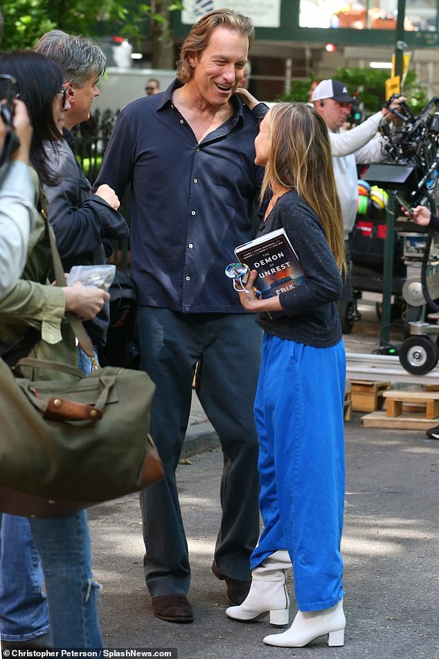 John Corbett was seen filming the next season of And Just Like That on Tuesday.  At the end of the hit show's final season, it was unknown if he would return, but he clearly will.  The actor was seen hugging co-star Sarah Jessica Parker between scenes