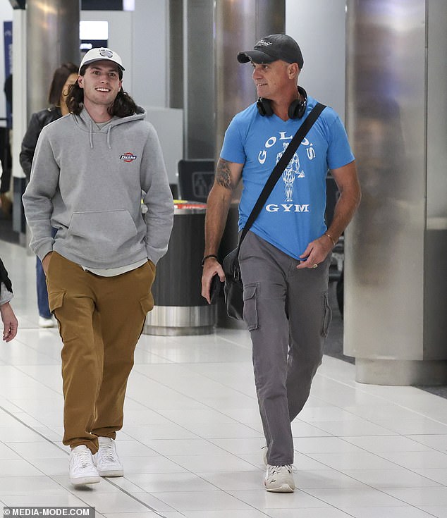 Shannon showed off his muscular gear in a tight blue logo T-shirt and gray cargo pants