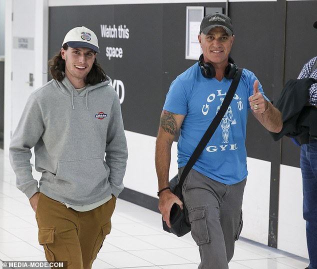 Shannon Noll (left) was spotted at Sydney Airport on Monday with his heartthrob son Blake (right).