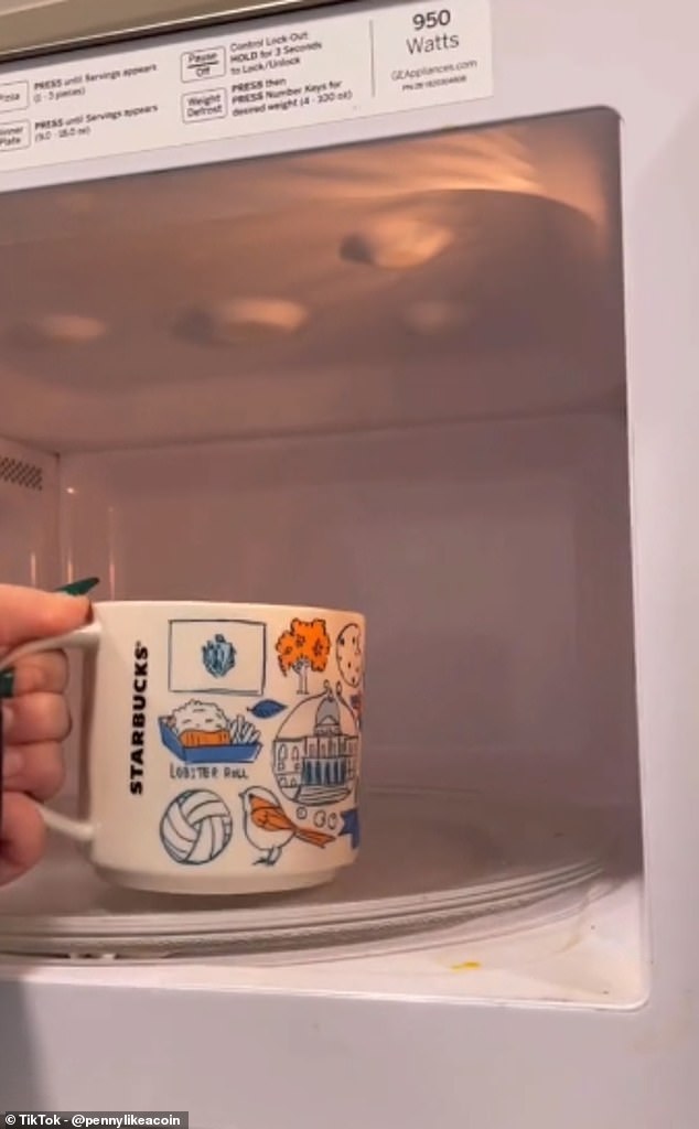 The footage shows Penny filling a Starbucks mug with cold tap water before placing it in the microwave