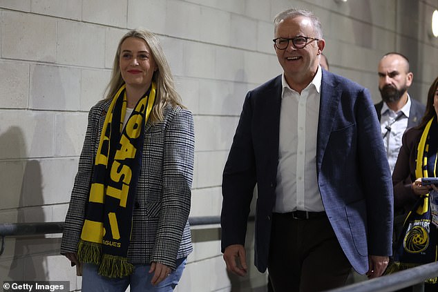Anthony Albanese (pictured with his fiancée Jodie Haydon) appeared without a scarf in the A-League semi-final between Central Coast Mariners and Sydney FC on Saturday evening