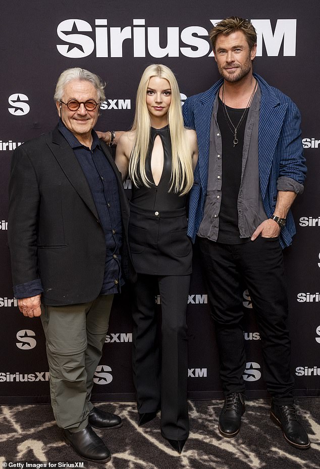 Anya was interviewed by her Furiosa co-star Chris Hemsworth for the magazine, with the actor, 40, asking her: 'You were ready to shave your head but George wouldn't let you?'  (L-R: Furiosa: A Mad Max Saga director George Miller, Anya and Chris pictured this month)