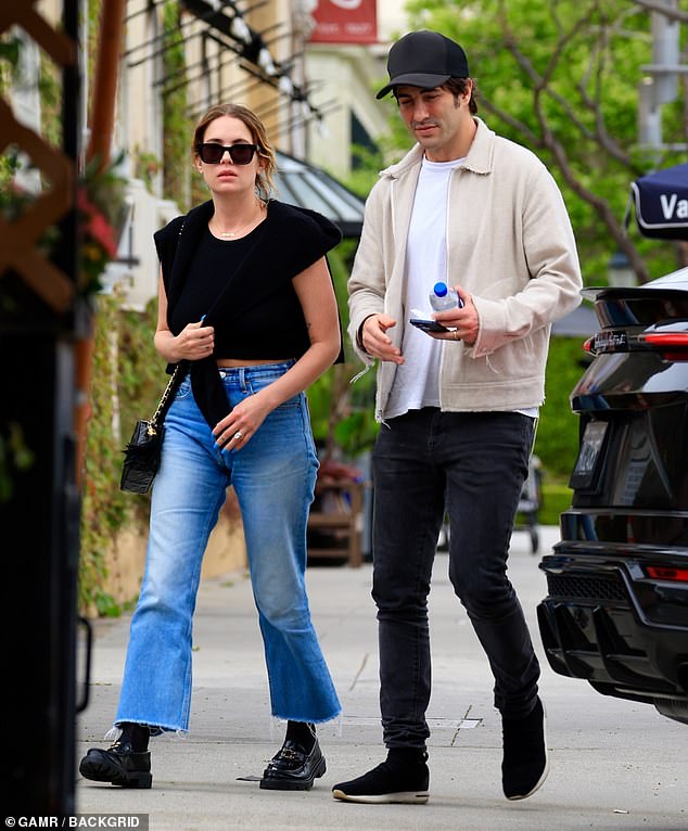 Ashley Benson and her husband Brandon Davis looked very much in love in Beverly Hills on Wednesday afternoon.  The power couple was spotted walking side by side along a tree-lined sidewalk