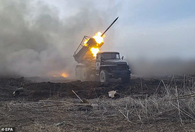 A still image from a handout video made available by the Russian Ministry of Defense press service shows Russian forces firing a Grad multiple launch rocket system (MLRS) at a secret position in the Donetsk region, eastern Ukraine