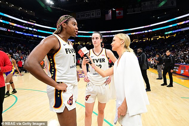 Aliyah Boston (left) and Caitlin Clark (center) speak after their first win of the WNBA season