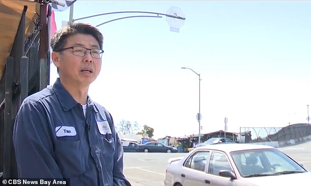 The owner of an auto repair shop at the corner of the intersection, Tam Le (pictured), said the city is indicating it is 