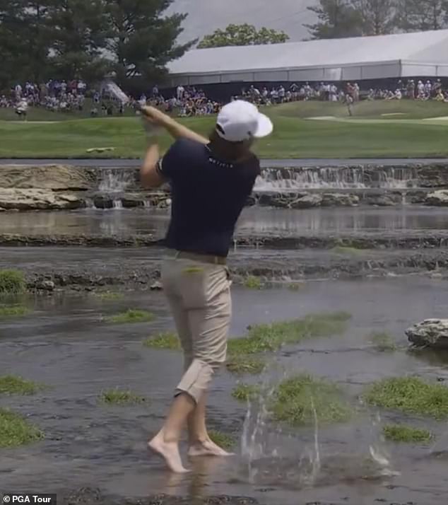 Smith took off his shoes and socks to make this shot on even footing in Kentucky, where he is still in contention Friday