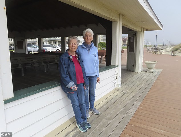 Local resident Harriet Bernstein (right, pictured with her partner, left) said: 'I feel less comfortable imposing their religion on everyone who lives here'