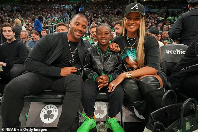 Ciara, 38, beamed in a graphic T-shirt as she and husband Russell Wilson, 35, and son Future, 9, attended the Boston Celtics vs. Cleveland Cavaliers NBA game in Boston on Wednesday