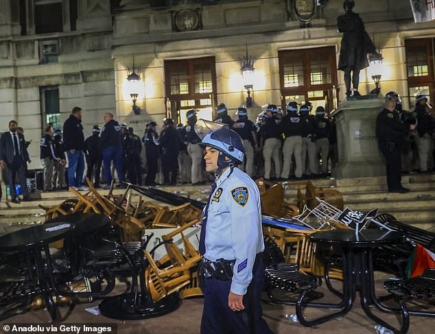 New York Police Department officers arrest dozens of pro-Palestinian students at Columbia University on Tuesday evening after barricading themselves in the Hamilton Hall building near the Gaza Solidarity Encampment