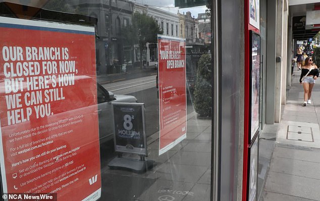 Hundreds of branches of the Big Four banks have closed across Australia in recent years and even more have gone 'cashless' (photo: Westpac Bank branch with a closed sign on the window)