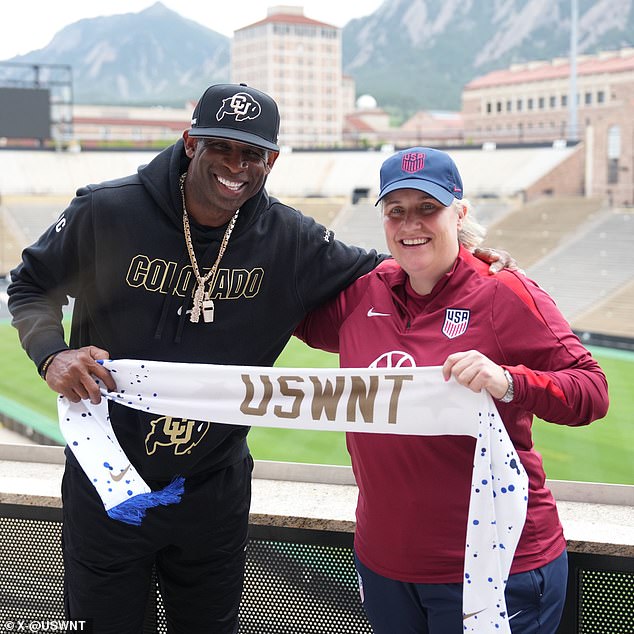 Colorado football coach Deion Sanders and Emma Hayes held up a USWNT scarf together