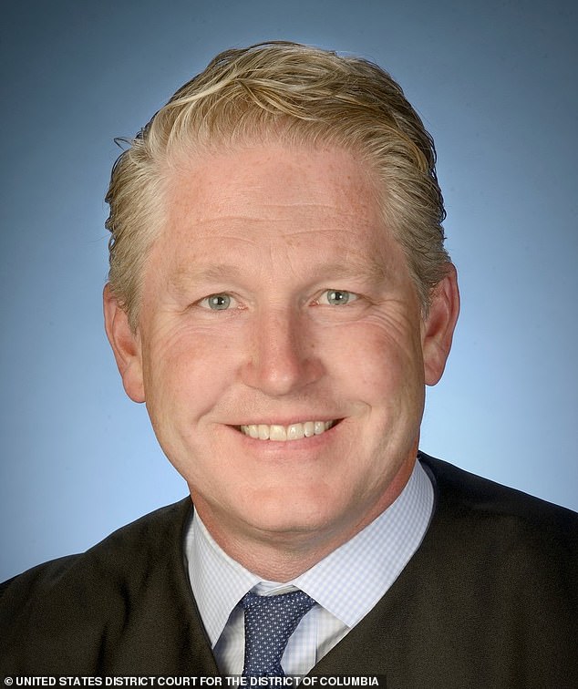 United States District Judge Carl J. Nichols.  Carl John Nichols considers the case brought by The Heritage Foundation against the Biden administration over Harry's immigration status
